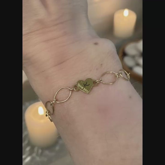 Gold Love you heart charm added to Infinity Bracelet