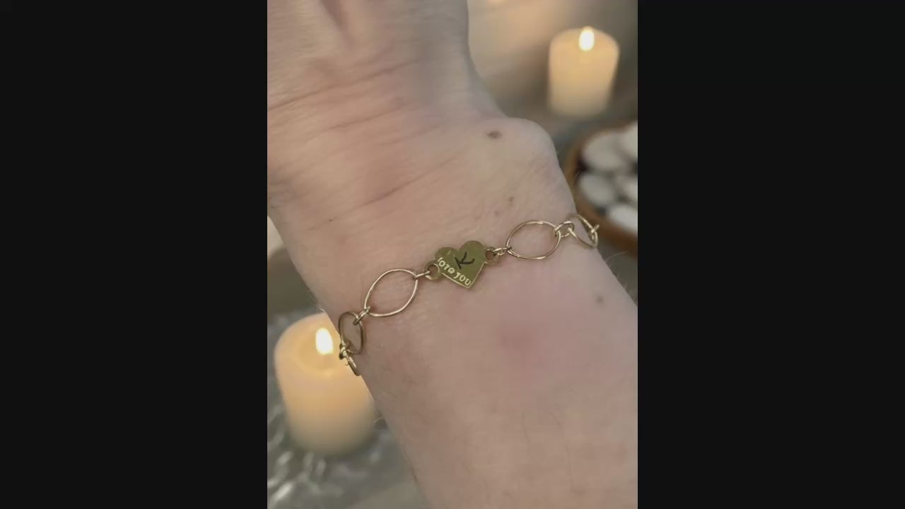 Gold Love you heart charm added to Infinity Bracelet