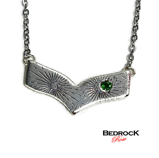 Radiating line patterned silver chevron necklace emerald-nanogem accent